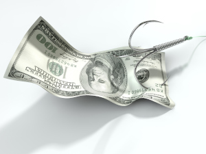 A concept image showing a one hundred dollar banknote used as bait attached to a treble fishhook and fishing line on an isolated white background